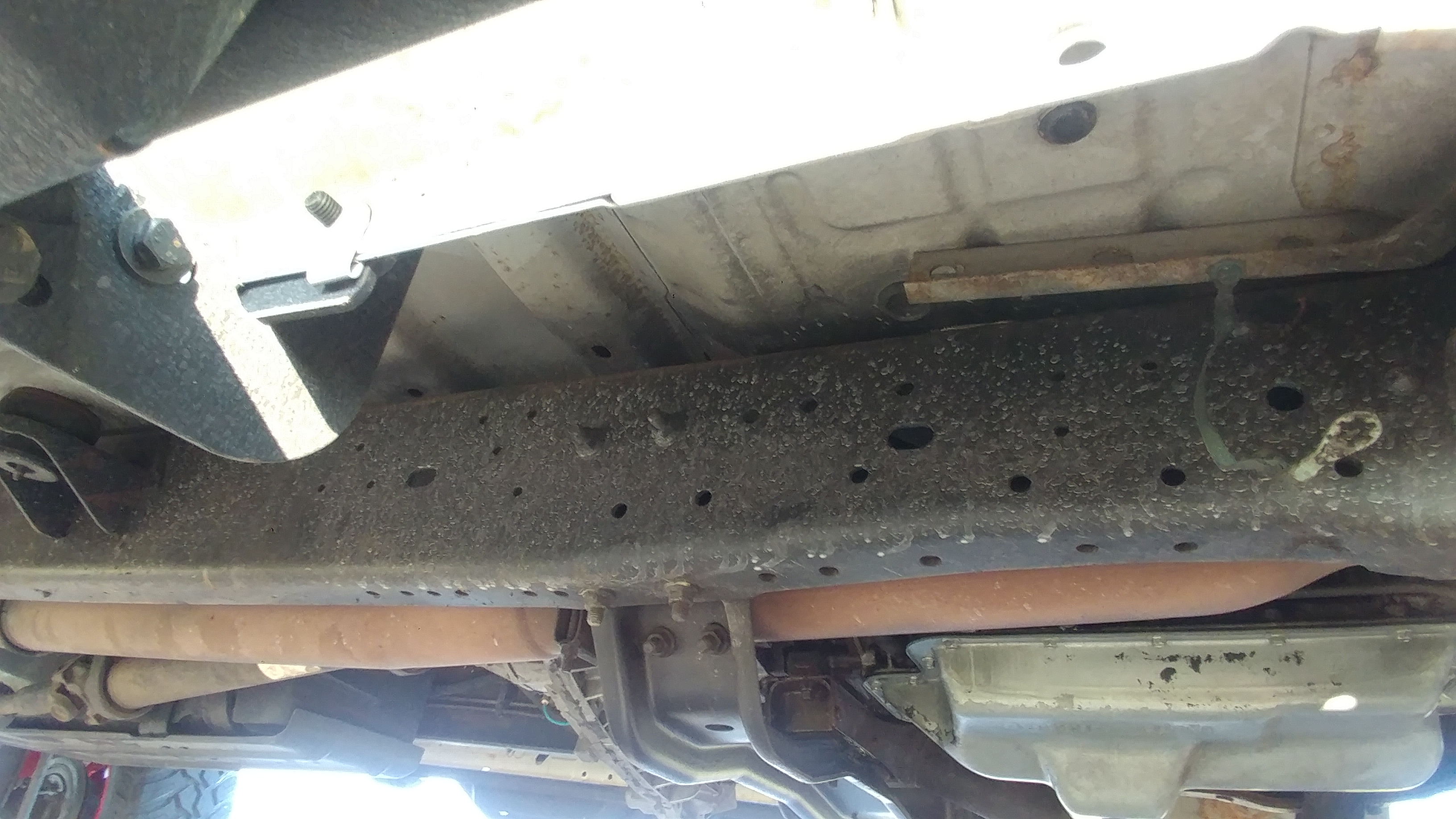 Underside view of the frame rail and fuel tank