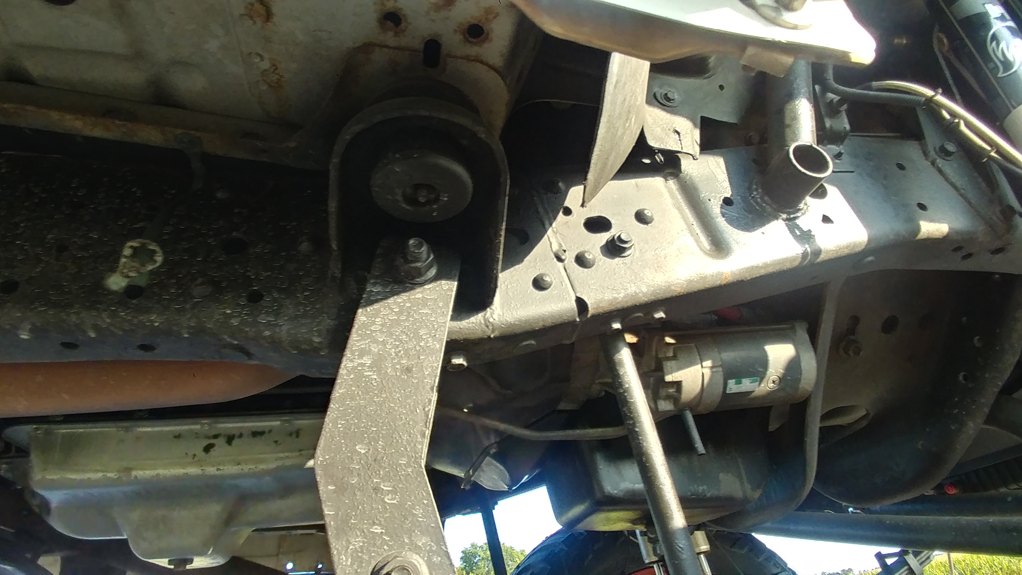 Underside showing the starter and transmission crossmember