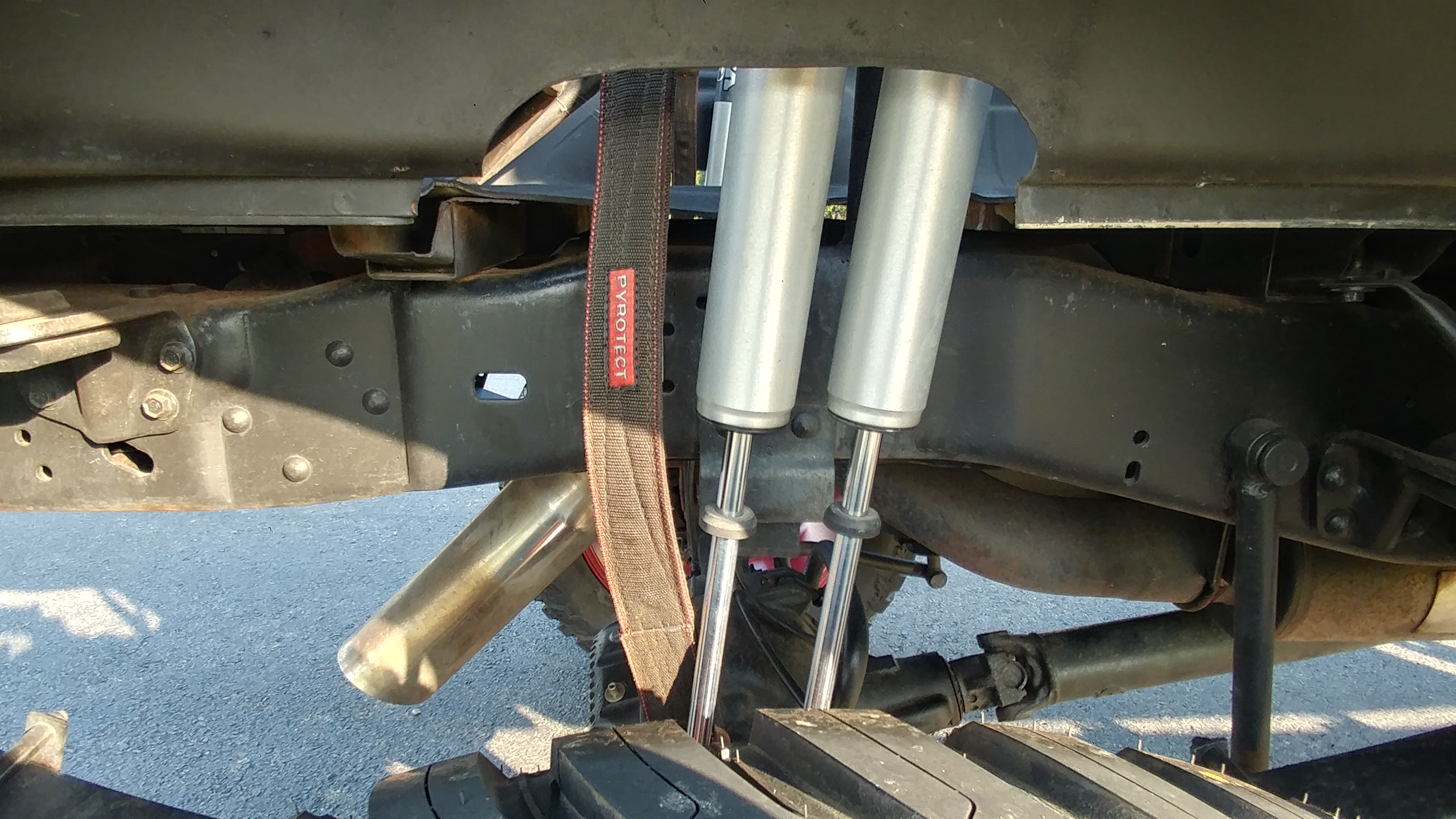 Fox shocks with a Pyrotect limiting strap on the axle